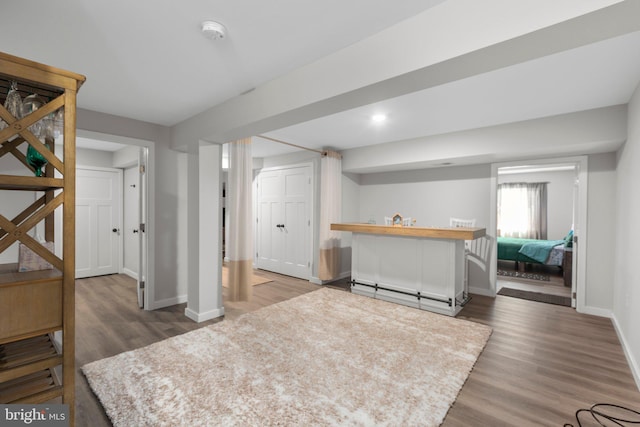 12037 Angora Dr, King George, VA 22485 - indoor wet bar featuring baseboards and wood finished floors