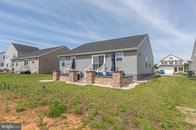 12037 Angora Dr, King George, VA 22485 - back of house with central AC, a yard, and entry steps