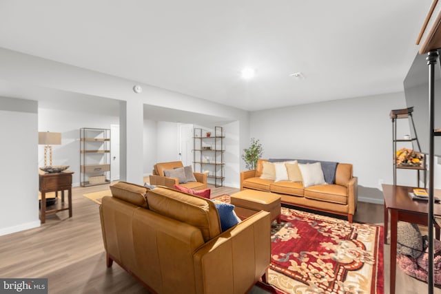 12037 Angora Dr, King George, VA 22485 - living room featuring light wood-style flooring, baseboards, and recessed lighting