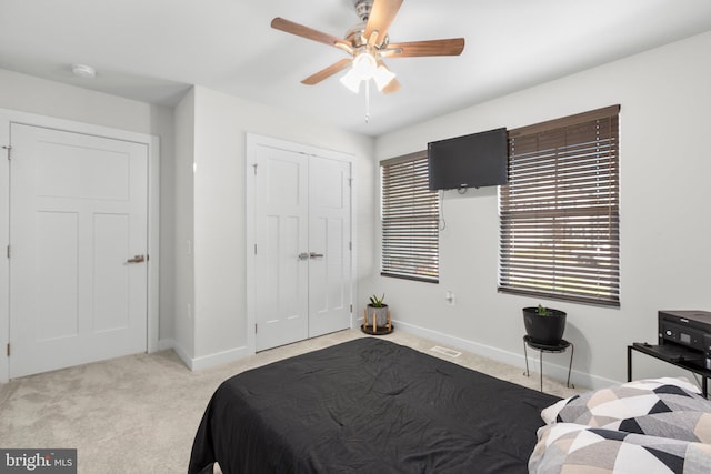 12037 Angora Dr, King George, VA 22485 - bedroom with light carpet, baseboards, a closet, and ceiling fan