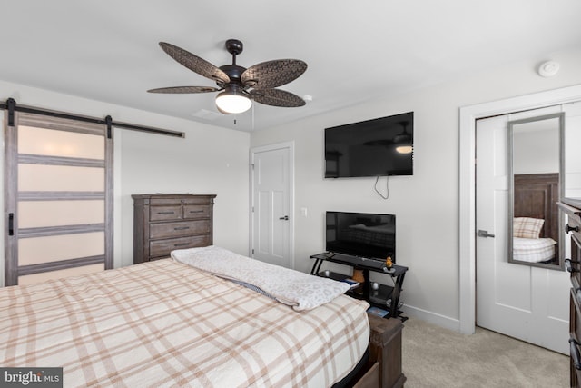 12037 Angora Dr, King George, VA 22485 - bedroom featuring a barn door, light carpet, baseboards, a closet, and ceiling fan