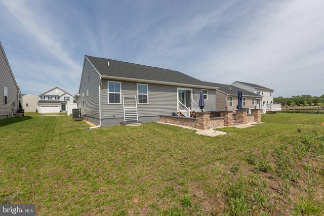 12037 Angora Dr, King George, VA 22485 - rear view of house with a yard