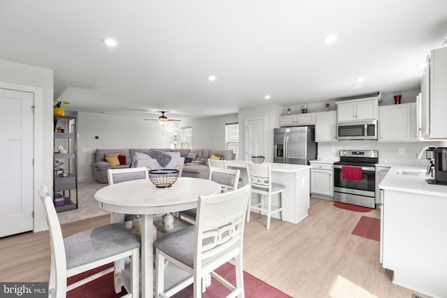 12037 Angora Dr, King George, VA 22485 - dining space with light wood-type flooring, ceiling fan, and recessed lighting