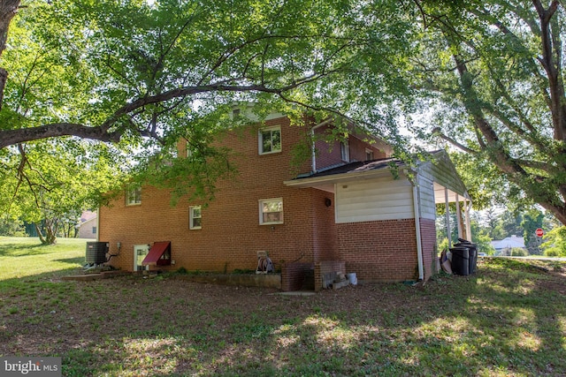 25 Panorama Dr, Oxon Hill, MD 20745 - view of side of home with brick siding, cooling unit, and a yard
