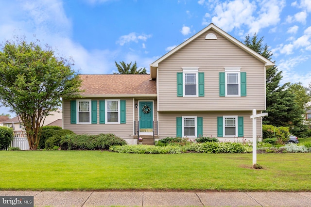 21 Bancroft St, Taneytown, MD 21787 - tri-level home featuring a front lawn