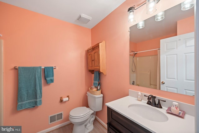 21 Bancroft St, Taneytown, MD 21787 - full bath with toilet, vanity, a shower, baseboards, and wood finished floors