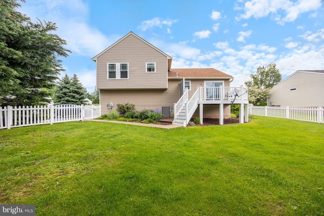 21 Bancroft St, Taneytown, MD 21787 - rear view of property with stairway and a wooden deck