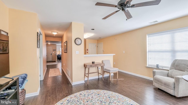 628 E Regency Dr, Absecon, NJ 08205 - sitting room with wood finished floors, ceiling fan, and baseboards