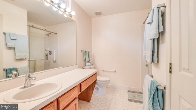 628 E Regency Dr, Absecon, NJ 08205 - full bathroom featuring a shower with door, vanity, toilet, and tile patterned flooring