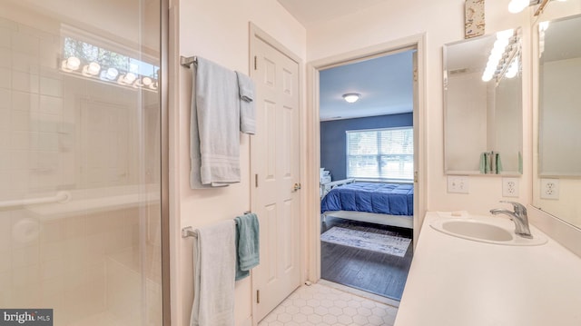 628 E Regency Dr, Absecon, NJ 08205 - full bath with ensuite bath, a shower stall, tile patterned floors, and vanity