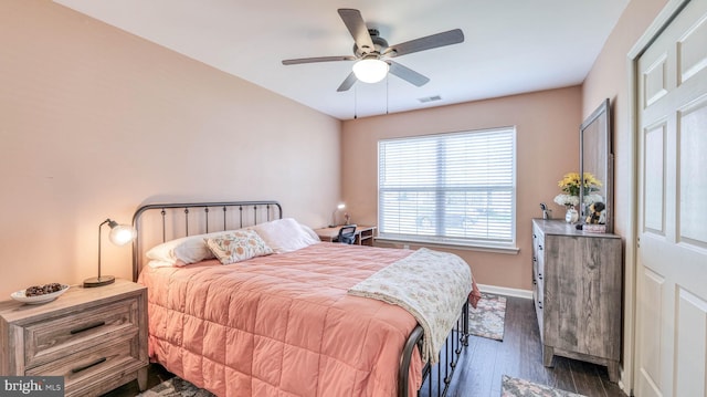 628 E Regency Dr, Absecon, NJ 08205 - bedroom with dark wood-type flooring, a ceiling fan, and baseboards