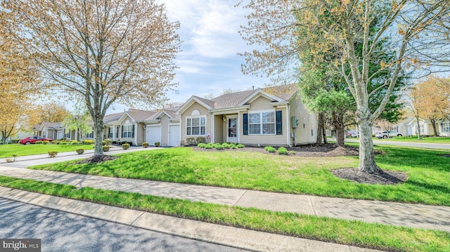 628 E Regency Dr, Absecon, NJ 08205 - single story home featuring a garage, driveway, and a front lawn