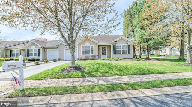 628 E Regency Dr, Absecon, NJ 08205 - ranch-style house featuring driveway, a garage, and a front yard