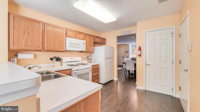 628 E Regency Dr, Absecon, NJ 08205 - kitchen featuring white appliances, a sink, light countertops, dark wood-type flooring, and baseboards
