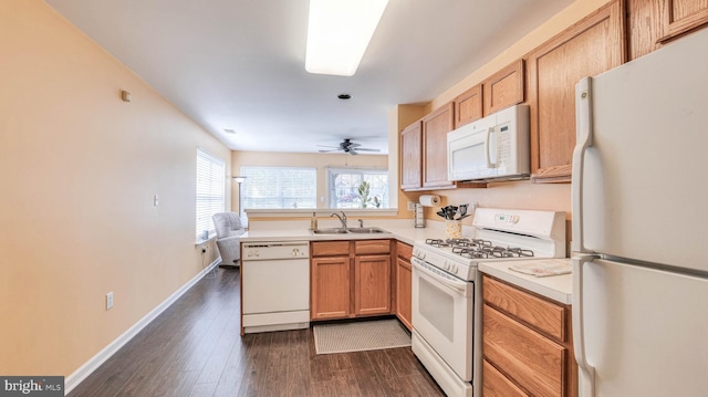 628 E Regency Dr, Absecon, NJ 08205 - kitchen with white appliances, a sink, light countertops, dark wood-type flooring, and baseboards