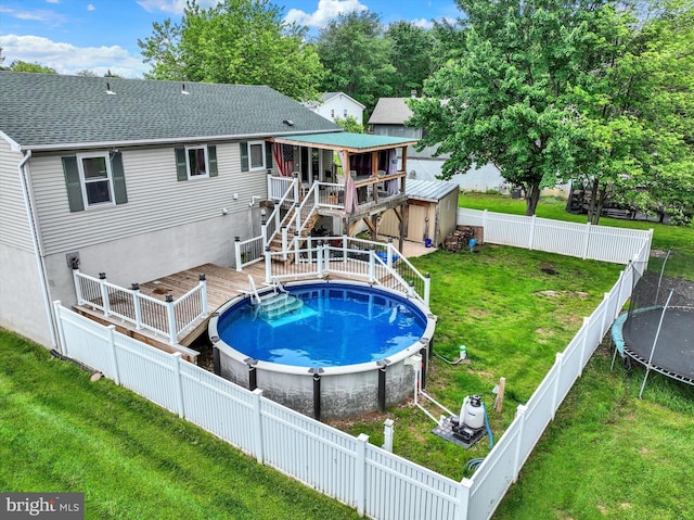 3111 Jessica Rd, Dover, PA 17315 - view of pool featuring a trampoline, a wooden deck, and stairs