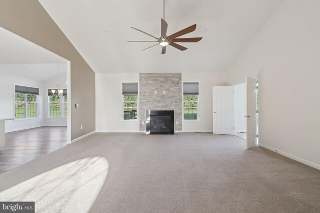 11202 King Gallahan Ct, Clinton, MD 20735 - unfurnished living room featuring high vaulted ceiling, carpet flooring, a ceiling fan, a chandelier, and a fireplace