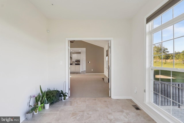 11202 King Gallahan Ct, Clinton, MD 20735 - hallway featuring baseboards, light colored carpet, and light tile patterned floors