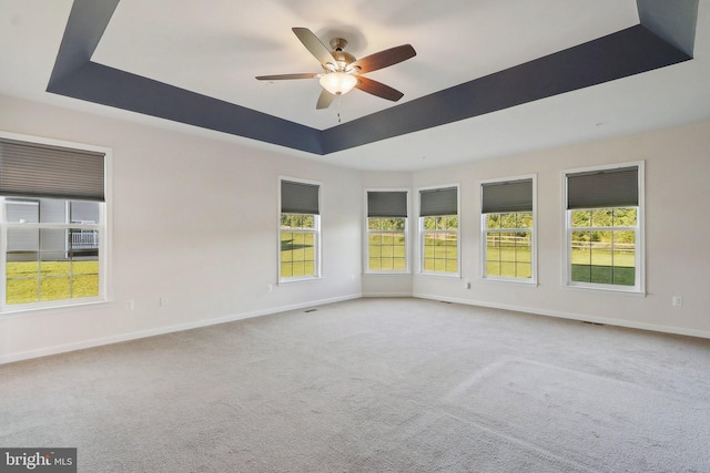 11202 King Gallahan Ct, Clinton, MD 20735 - empty room with a raised ceiling, ceiling fan, carpet floors, and baseboards