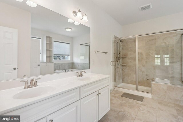 11202 King Gallahan Ct, Clinton, MD 20735 - bathroom with tile patterned floors, a shower stall, and double vanity