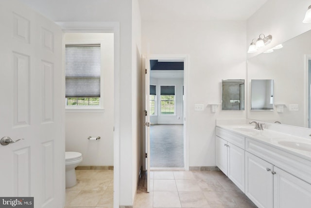 11202 King Gallahan Ct, Clinton, MD 20735 - full bathroom featuring double vanity, toilet, baseboards, and tile patterned floors