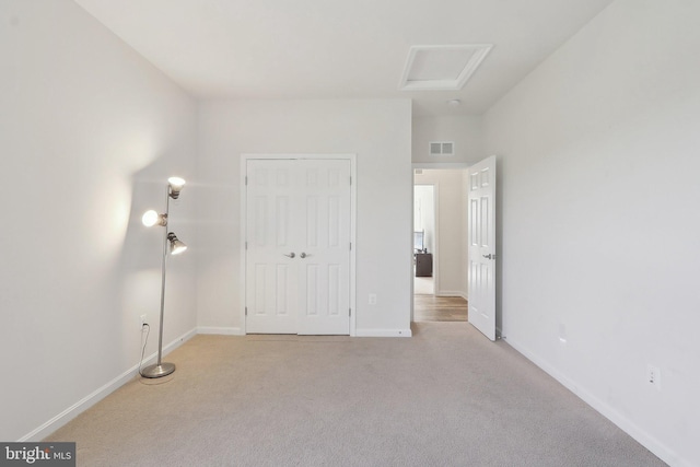 11202 King Gallahan Ct, Clinton, MD 20735 - unfurnished bedroom with light colored carpet, baseboards, and attic access