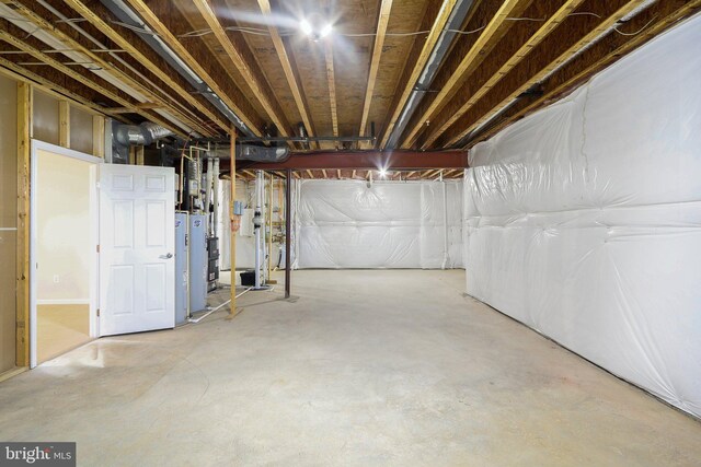 11202 King Gallahan Ct, Clinton, MD 20735 - unfinished below grade area with electric water heater