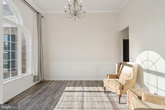 11202 King Gallahan Ct, Clinton, MD 20735 - living area with a chandelier, healthy amount of natural light, light wood-style floors, and ornamental molding