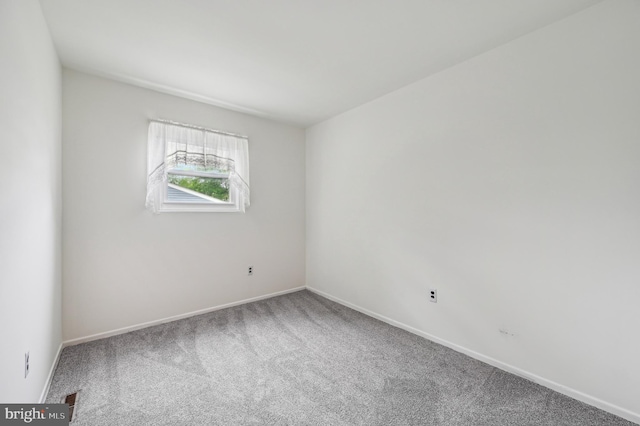 225 Dunlap Rd, Pasadena, MD 21122 - carpeted empty room with baseboards