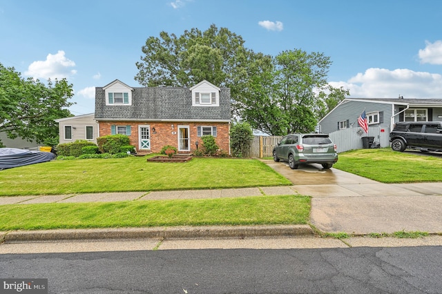 225 Dunlap Rd, Pasadena, MD 21122 - dutch colonial featuring brick siding, driveway, and roof with shingles