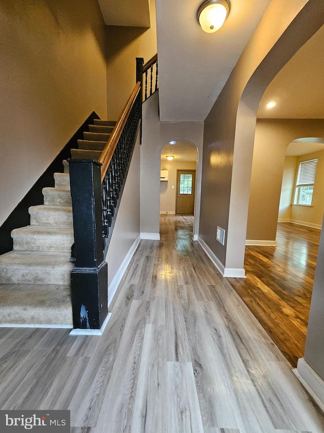 413 10th Ave, Altoona, PA 16602 - foyer entrance with arched walkways, wood finished floors, and stairs