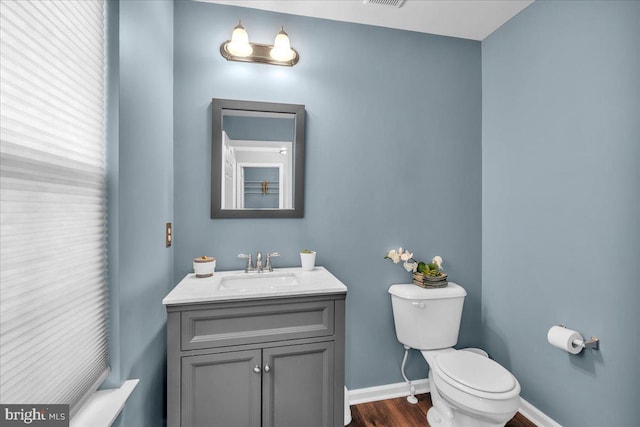 6 Hedwig Ct, Voorhees, NJ 08043 - half bathroom featuring toilet, vanity, baseboards, and wood finished floors