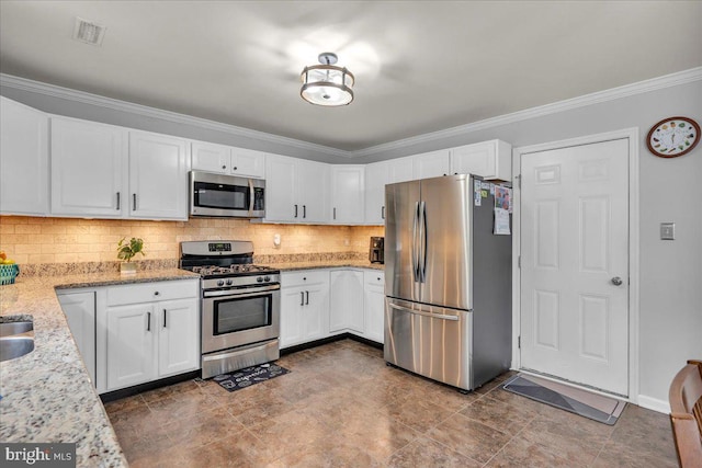 6 Hedwig Ct, Voorhees, NJ 08043 - kitchen with appliances with stainless steel finishes, white cabinets, decorative backsplash, light stone countertops, and crown molding
