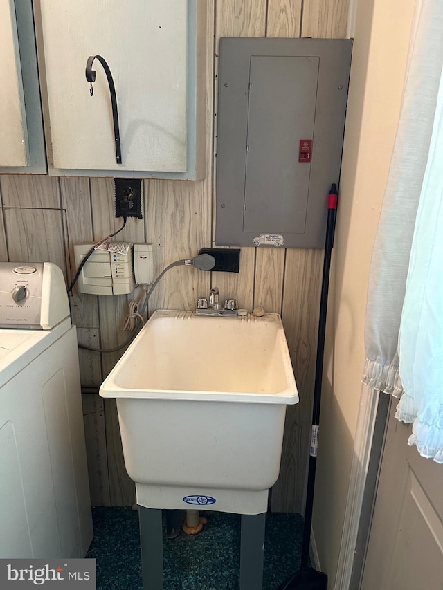 206 Taylor Rd, Wilmington, DE 19804 - bathroom featuring washer / dryer, electric panel, a sink, and a freestanding bath