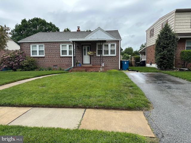 206 Taylor Rd, Wilmington, DE 19804 - view of front of home featuring brick siding and a front lawn