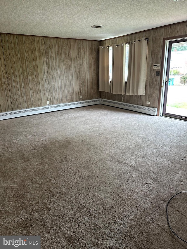 206 Taylor Rd, Wilmington, DE 19804 - carpeted empty room with a textured ceiling and wooden walls