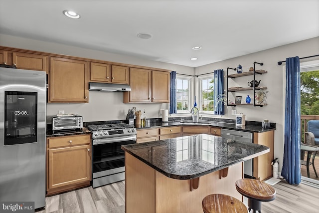 129 Helen Dr, Cinnaminson, NJ 08077 - kitchen featuring appliances with stainless steel finishes, under cabinet range hood, light wood-type flooring, a breakfast bar, and recessed lighting