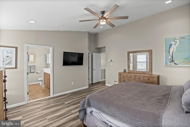 129 Helen Dr, Cinnaminson, NJ 08077 - bedroom featuring wood finished floors, recessed lighting, vaulted ceiling, ensuite bath, and a ceiling fan