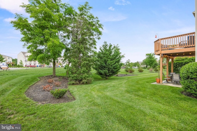 129 Helen Dr, Cinnaminson, NJ 08077 - view of green lawn featuring a deck and a patio