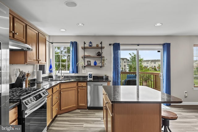 129 Helen Dr, Cinnaminson, NJ 08077 - kitchen with appliances with stainless steel finishes, light wood-type flooring, a kitchen bar, recessed lighting, and a kitchen island
