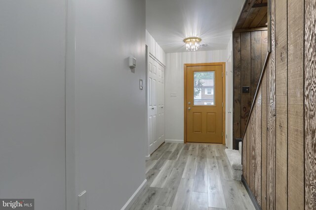 69 Drexel Pl, New Cumberland, PA 17070 - doorway to outside featuring wooden walls, light wood-style flooring, and baseboards