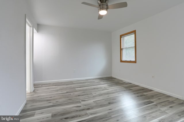 69 Drexel Pl, New Cumberland, PA 17070 - unfurnished room with a ceiling fan, light wood finished floors, and baseboards