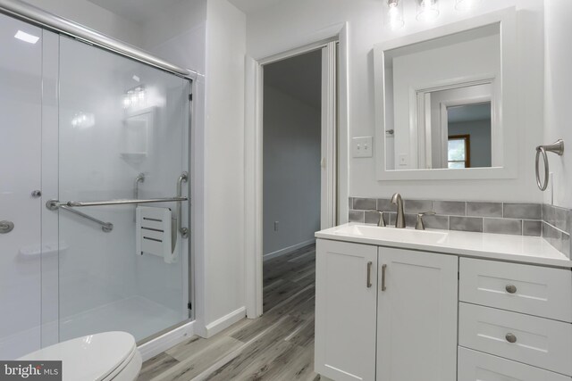 69 Drexel Pl, New Cumberland, PA 17070 - bathroom featuring vanity, a stall shower, wood finished floors, and toilet