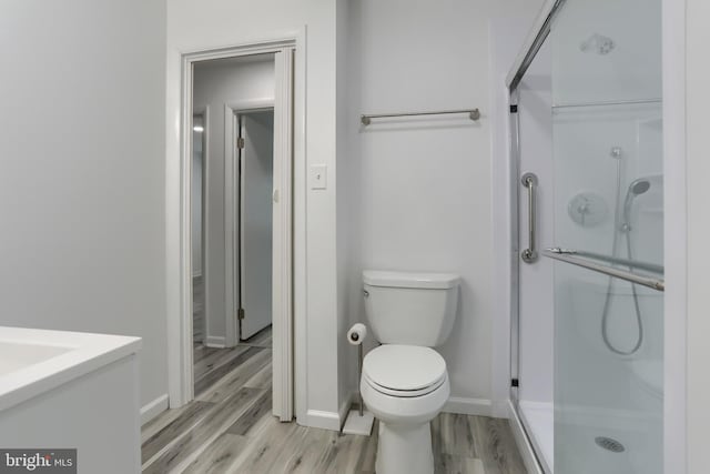 69 Drexel Pl, New Cumberland, PA 17070 - bathroom with a stall shower, toilet, baseboards, and wood finished floors