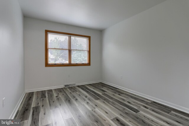 69 Drexel Pl, New Cumberland, PA 17070 - spare room with wood finished floors and baseboards