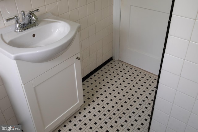 107 Bishops Ln, Baltimore, MD 21228 - bathroom featuring tile walls, vanity, and tile patterned flooring