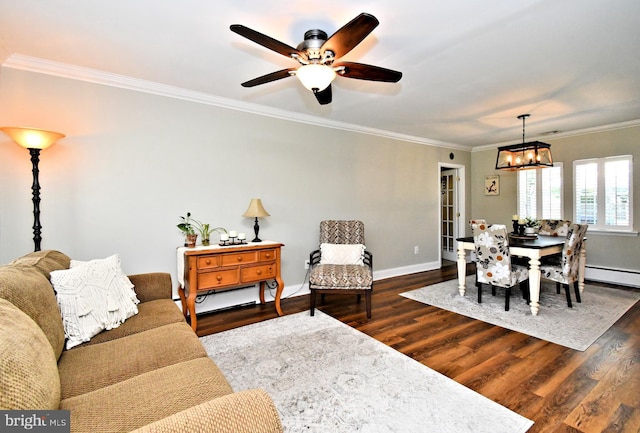 985 Jeffrey Dr, Southampton, PA 18966 - living room featuring dark wood finished floors, a chandelier, crown molding, a baseboard heating unit, and baseboards