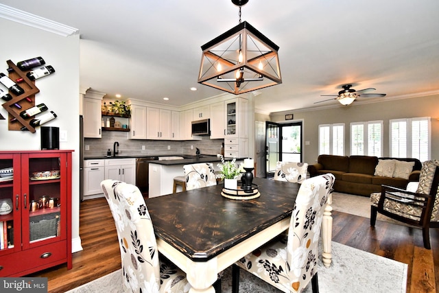 985 Jeffrey Dr, Southampton, PA 18966 - dining room with ornamental molding, dark wood-style flooring, ceiling fan, recessed lighting, and a chandelier