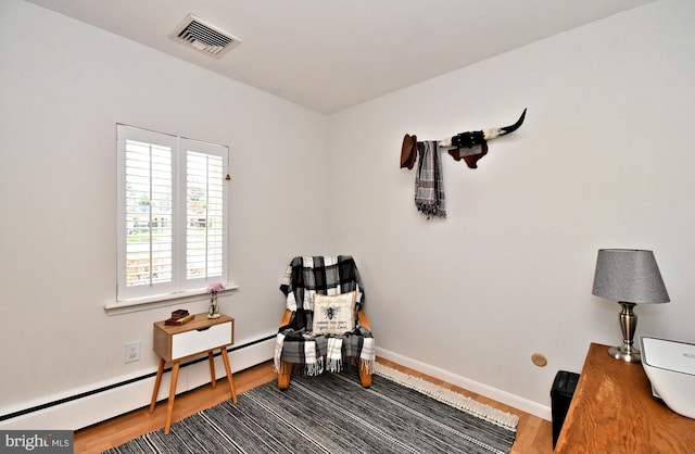 985 Jeffrey Dr, Southampton, PA 18966 - living area with wood finished floors, a baseboard radiator, and baseboards