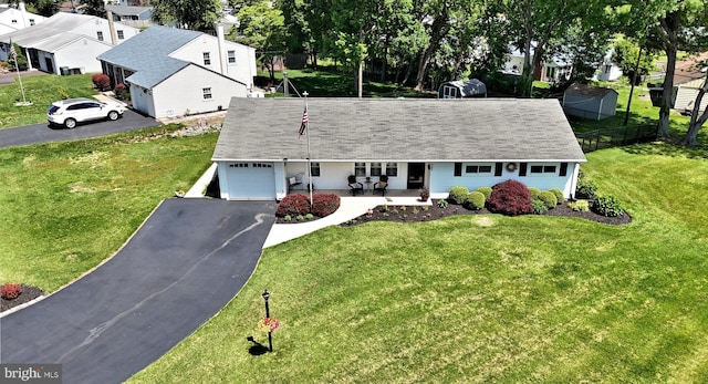 985 Jeffrey Dr, Southampton, PA 18966 - view of front of house featuring a garage, driveway, a porch, and a residential view